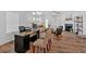 A well-lit open concept living space features hardwood floors and a fireplace at 2703 Jordan Ln, Lithia Springs, GA 30122
