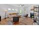 Bright living room featuring a fireplace, modern decor and hardwood flooring at 2703 Jordan Ln, Lithia Springs, GA 30122