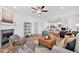 Open concept living room with fireplace, eat-in kitchen and hardwood floors at 2703 Jordan Ln, Lithia Springs, GA 30122