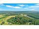 Expansive aerial view of lush greenery with a beautiful tree line surrounding the property at 3122 Harmony Rd, Temple, GA 30179