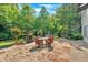 Outdoor entertaining area features a stone patio and fireplace at 3122 Harmony Rd, Temple, GA 30179