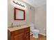 Bathroom features vanity with solid surface countertop and tile floors at 3122 Harmony Rd, Temple, GA 30179