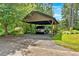 Spacious carport with ample parking space, providing convenient shelter for vehicles at 3122 Harmony Rd, Temple, GA 30179