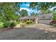 Charming single-story home with a well-manicured lawn and a two-car garage at 3122 Harmony Rd, Temple, GA 30179