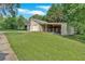 Detached two-car garage with ample storage space and an adjacent area for animals at 3122 Harmony Rd, Temple, GA 30179