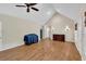 Bright living room with hardwood floors, vaulted ceilings, and modern fixtures at 3122 Harmony Rd, Temple, GA 30179