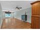 Open living room with hardwood floors, neutral paint and modern lighting at 3122 Harmony Rd, Temple, GA 30179