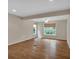Spacious living room with hardwood floors, neutral walls and modern ceiling fan at 3122 Harmony Rd, Temple, GA 30179