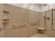 Accessible walk-in shower with grab bars and bench seating at 3122 Harmony Rd, Temple, GA 30179