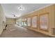 Sunroom features bamboo blinds, ceiling fan, and neutral walls at 3122 Harmony Rd, Temple, GA 30179