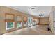 Bright sunroom with bamboo blinds, ceiling fan, and neutral walls at 3122 Harmony Rd, Temple, GA 30179