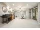 Spacious basement featuring a dining area, kitchenette, and access to the outdoors through elegant French doors at 4138 Glenlake Nw Ter, Kennesaw, GA 30144