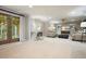 Inviting basement with a comfortable seating area and a functional workspace by the French doors at 4138 Glenlake Nw Ter, Kennesaw, GA 30144