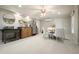 Cozy basement area with kitchenette including stainless steel refrigerator and a dining area with seating for four at 4138 Glenlake Nw Ter, Kennesaw, GA 30144