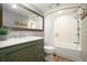 Charming bathroom with a rustic-style vanity, a large mirror, and a tiled shower-tub combination at 4138 Glenlake Nw Ter, Kennesaw, GA 30144