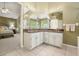 Bright bathroom featuring double vanity with granite countertop and tiled floors at 4138 Glenlake Nw Ter, Kennesaw, GA 30144