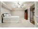 Serene bedroom with a cozy bed, a dark wood dresser with TV, and a well-organized closet system at 4138 Glenlake Nw Ter, Kennesaw, GA 30144