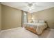 Comfortable bedroom featuring neutral walls, plush carpet and a ceiling fan at 4138 Glenlake Nw Ter, Kennesaw, GA 30144