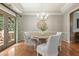 Formal dining room featuring hardwood floors, neutral paint and a chandelier at 4138 Glenlake Nw Ter, Kennesaw, GA 30144
