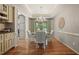 Formal dining room with trey ceiling, chandelier, and sliding glass doors to the backyard at 4138 Glenlake Nw Ter, Kennesaw, GA 30144