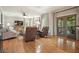 Comfortable living room features hardwood floors, neutral paint, and glass doors to a beautiful outdoor living space at 4138 Glenlake Nw Ter, Kennesaw, GA 30144