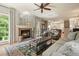 Spacious living room boasting a warm fireplace, elegant furnishings, and an open floor plan at 4138 Glenlake Nw Ter, Kennesaw, GA 30144
