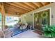 Charming covered patio with comfortable seating and views of the backyard at 4138 Glenlake Nw Ter, Kennesaw, GA 30144