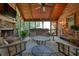 Inviting sunroom with wood plank flooring and ceiling, a stone fireplace, and comfortable seating at 4138 Glenlake Nw Ter, Kennesaw, GA 30144
