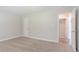 Carpeted bedroom with a closet and entry doorway at 45 Kelsey Way, Palmetto, GA 30268