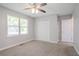 Bedroom with ceiling fan, large closet, and a window at 45 Kelsey Way, Palmetto, GA 30268