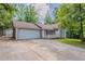 Inviting single-story home features a spacious driveway, attached garage, and welcoming front porch at 45 Kelsey Way, Palmetto, GA 30268
