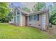 Exterior view of home with grass yard, stucco, and window at 45 Kelsey Way, Palmetto, GA 30268