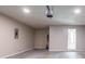 Spacious garage with overhead lighting and entry door at 45 Kelsey Way, Palmetto, GA 30268
