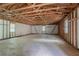 Large garage with exposed rafters and concrete floor at 45 Kelsey Way, Palmetto, GA 30268