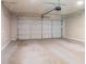 Garage with concrete floor and roll-up door at 45 Kelsey Way, Palmetto, GA 30268