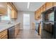 Kitchen with ample cabinet space, wood-look floors and appliances at 45 Kelsey Way, Palmetto, GA 30268