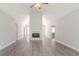Spacious living room with vaulted ceiling, fireplace, and modern floors, creating a cozy atmosphere at 45 Kelsey Way, Palmetto, GA 30268