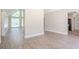 Bright and airy living space showcasing modern flooring and an open layout into the kitchen at 45 Kelsey Way, Palmetto, GA 30268
