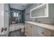Bathroom features a shower-tub combo and vanity with neutral countertop at 1024 Regis Rd, Atlanta, GA 30315