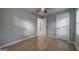 Bedroom features neutral toned floor, ceiling fan, and two closets at 1024 Regis Rd, Atlanta, GA 30315