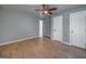 Bedroom features neutral toned floor, ceiling fan, and two closets at 1024 Regis Rd, Atlanta, GA 30315