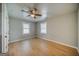Bedroom features neutral toned floor, ceiling fan, and natural light from the windows at 1024 Regis Rd, Atlanta, GA 30315
