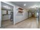 Hallway leading to the utilities closet and to a living room featuring sleek modern flooring at 1024 Regis Rd, Atlanta, GA 30315