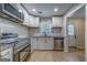 Bright kitchen with granite countertops, stainless steel appliances, and white cabinets offers a modern, updated space at 1024 Regis Rd, Atlanta, GA 30315