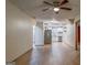 Open living area with modern flooring and updated ceiling fan adjacent to a kitchen featuring stainless appliances at 1024 Regis Rd, Atlanta, GA 30315