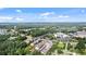A birds-eye view of the community, near mature trees, landscaping, and nearby businesses at 117 Via Roma, Woodstock, GA 30188