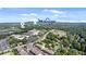 A birds-eye view of the community, near grocery stores, mature trees, and landscaping at 117 Via Roma, Woodstock, GA 30188