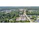 An aerial view of a beautiful townhome community surrounded by mature trees and landscaping at 117 Via Roma, Woodstock, GA 30188