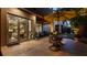 Outdoor patio featuring stone flooring, outdoor umbrella, and view into the home's living spaces at 117 Via Roma, Woodstock, GA 30188