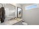 Charming half bathroom with granite countertop and stylish mirror at 117 Via Roma, Woodstock, GA 30188
